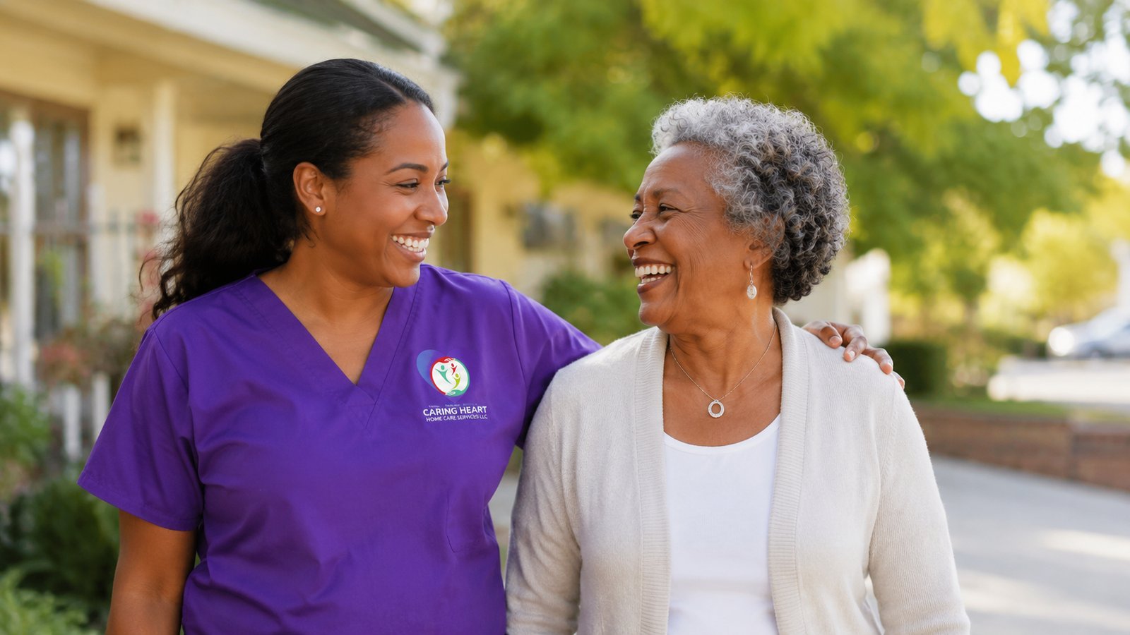 Caring Heart caregiver walking arm-in-arm outdoors with a smiling senior client